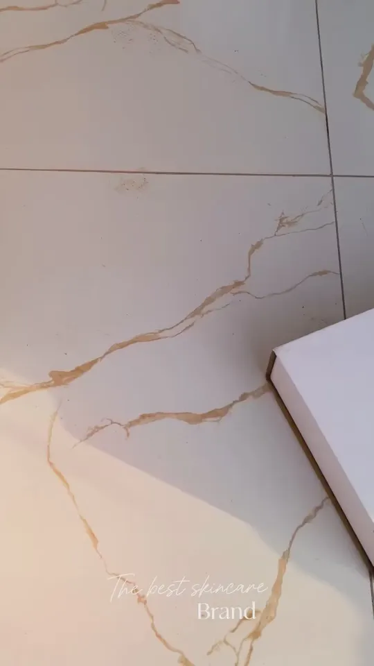 A MoraGlame box on a marble floor, about to be opened